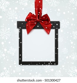 Blank, black square banner in form of Christmas gift with red ribbon and bow, on winter background with snow and snowflakes. Brochure or banner template.