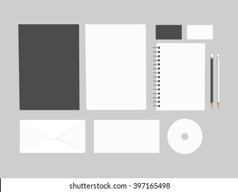 Blank branding mock up, isolated on grey background. Consist of CD, 2 sheets of paper A4, letters, business cards, spiral notepad, pencils. Vector, EPS10