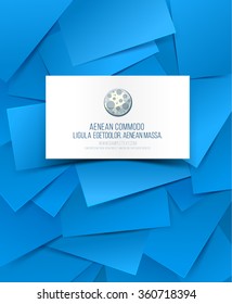 Blank business card with shadow on blue paper shapes background.