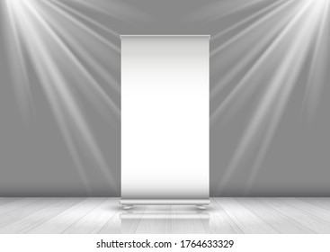 Blank business roll up banner in room with spotlights shining down