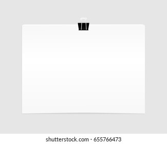 Blank empty sheet of paper attached with clip isolated on white background.