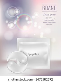 Blank foil or plastic sachet for cosmetic and eye gel patches on color background with bokeh effect