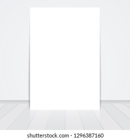 Blank frame paper sheet on wall background and wooden floor