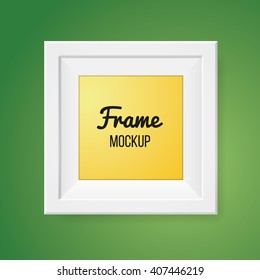 Blank frame template isolated on green wall. Mockup. Portfolio element. 