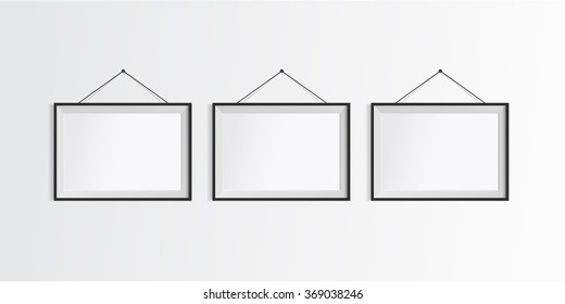 Blank frames on white wall.