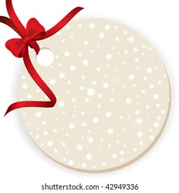 Blank gift tag tied with a bow of red ribbon