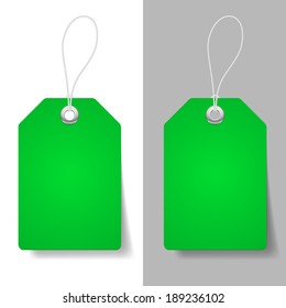 Blank green price tags on white and grey background 