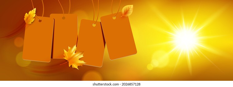 Blank hanging sales labels with flying autumn leaves and autumn bokeh sun background

