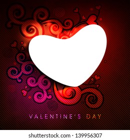 Blank heart shape on red floral decorated background.