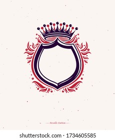 Blank heraldic design with copy space, vector vintage protection shield emblem decorated with royal crown and leaves.