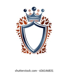 Blank heraldic design with copy space, vector vintage protection shield emblem decorated with royal crown and leaves.