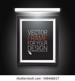 Blank illuminated picture frame on black background. Vector template for your presentations.