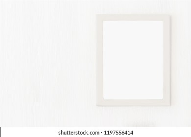 Blank light wooden frame for picture hanging on white wall. Mock up design. Realistic vector illustration
