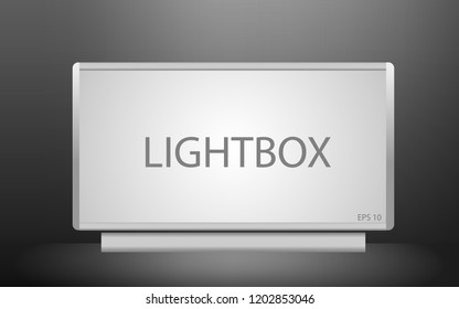 Blank lightbox in the dark. Illuminated lightbox screen with empty space for design.