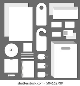 Blank mock up template. Vector corporate identity templates with shadows on gray background. Letterhead, envelope, business card, pencils, door hangers, CD, packaging, tags, ruler, flash drive