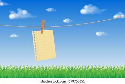 blank old note paper hanging on rope with wood clip and blue sky background with green grass on front, vector memo concept