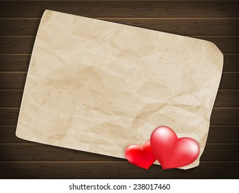 Blank old piece of paper and vintage handmade valentines day toy heart over wooden background. EPS 10 vector file included