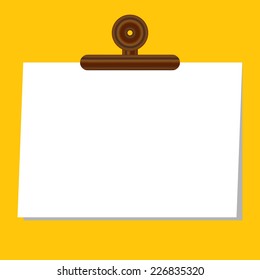 blank paper with clip on yellow background vector