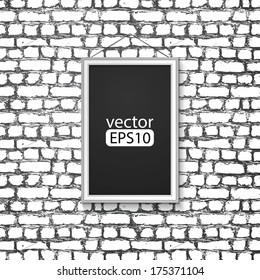 blank paper frame on brick wall