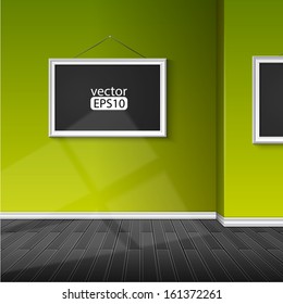 blank paper frame on green wall