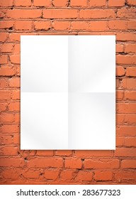 Blank paper poster on the red brick wall background. You can place your design and apply Transparency with Multiply blending mode to it. 