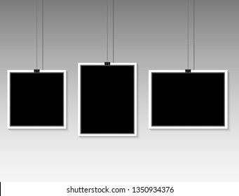 blank photo frame hanging on a line