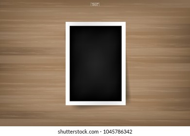 Blank photo frame or picture frame on wood background. Vector illustration.