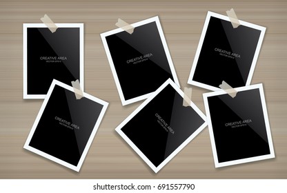Blank photo frame or picture frame stick on wood wall. Vector vintage background.