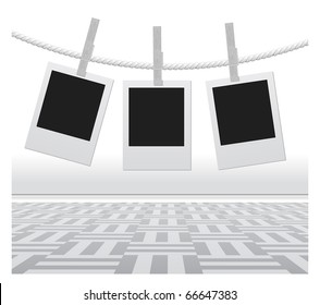 Blank photo frames hanging on a rope