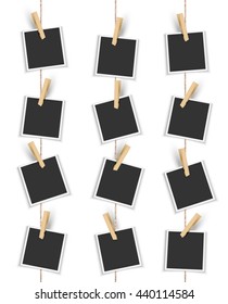 Blank photo frames hanging vertically with clothespin