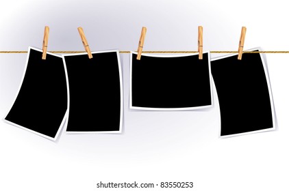 Blank photo frames on rope. Vector.