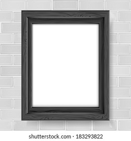 Blank picture frame on a brick wall