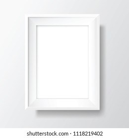 Blank picture frame template. Realistic white frame with shadow on white wall for photo or poster. Vertical orientation A4