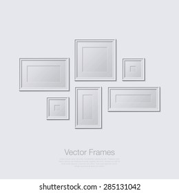 Blank picture frame template set. Empty isolated painting frames on white wall.