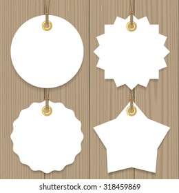 Blank sale tags mock up set. Hang tags with a string on wooden background. Round, star and badge shape. Shopping label with place for price and discount captions. Vector illustration.