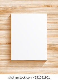 Blank sheet of paper on wood texture background