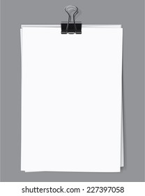 Blank sheets of paper fastened by a binder clip. Vector illustration