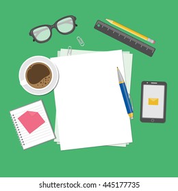 Blank sheets of paper on the desktop. View from above of blank sheets of paper, pen, ruler, pencil, smartphone, message, notebook, stickers, glasses, coffee cup. Preparation for work, notes, sketches.