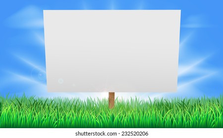 A blank sign standing in a summer field of grass