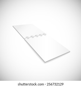Blank spiral notebook lying, isolated on white background.