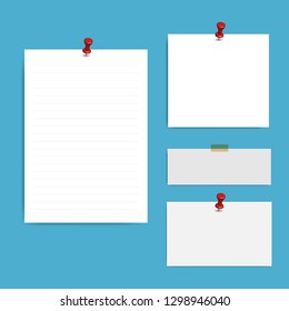 Blank squared notepad pages and pin. Note paper stuck with red pin.