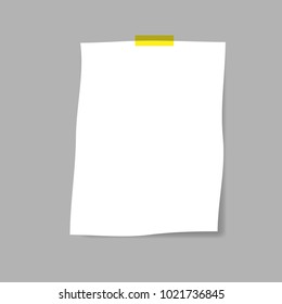 blank squared notepad pages and tape. Note paper stuck with beige sticky tape.