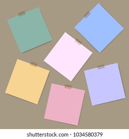 Blank squared notepad pages and tape. Note paper stuck with beige sticky tape.