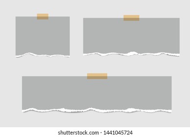 Blank squared notepad pages and tape. Note paper stuck with beige sticky tape.