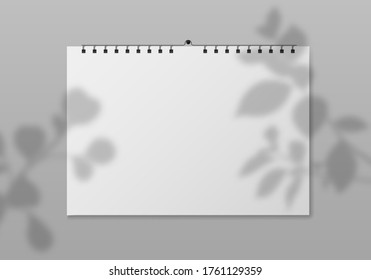 Blank wall calendar. Empty square planner front view with white paper pages and plant shadow. Date event, month diary, calendar template. vector mockup