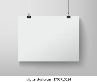 blank white banner hanging on the clamps on white background
