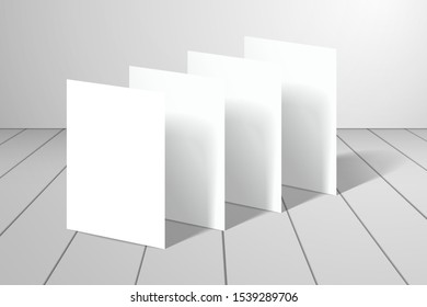Blank white cards standing in half a turn on the surface. Mockup for design with a shadows