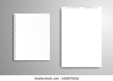 Blank white closed book or notebook with a spiral and calendar or poster. Top view mockup with shadow.  Isolated element for design