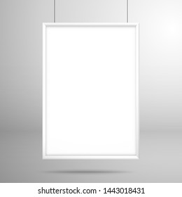 Blank white frame for a picture or poster is located above the surface. Mockup for design with shadow