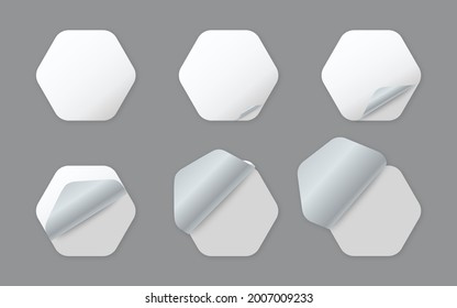 Blank white hexagonal paper stickers with curled corner